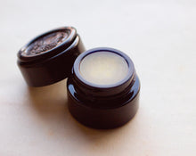 Load image into Gallery viewer, Figure 1: Noir Solid Perfume in Round Violet Jar